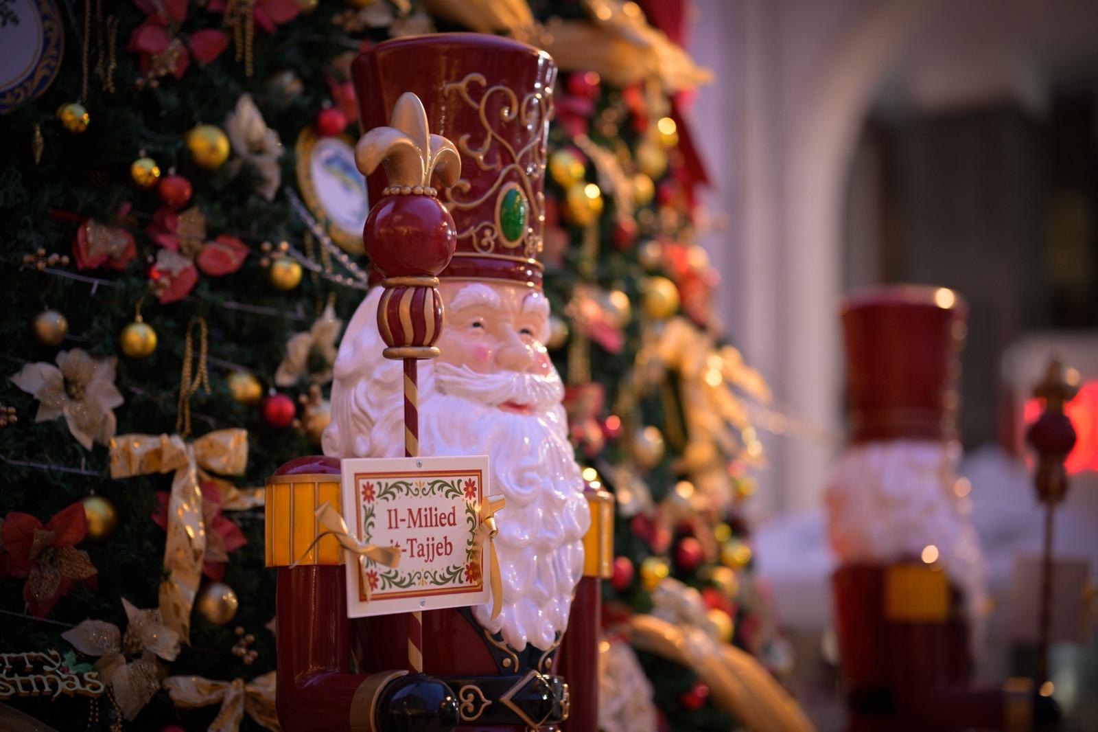 Christmas installation detail with Santa figure beside Malta's National Christmas Tree